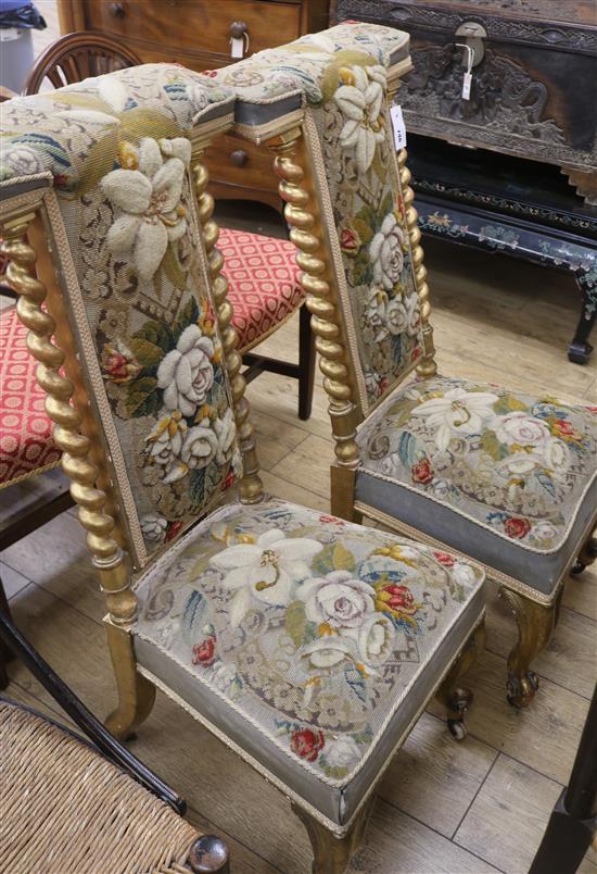 A pair of Victorian gilt wood and needlepoint prie dieu chairs